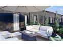 Inviting patio with comfortable seating and lush greenery, perfect for outdoor relaxation at 115 W 2Nd Ave # 101, Denver, CO 80223