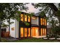 Striking two-story home showcasing a modern design with large windows offering ample natural light at 1117 S Madison St, Denver, CO 80210