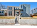 Contemporary home showcasing a stylish facade, front yard, and eye-catching architectural details at 4351 Yates St, Denver, CO 80212