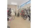 Secured bike storage room for residents, showing multiple bicycles neatly organized on wall racks at 603 Inca St # 429, Denver, CO 80204