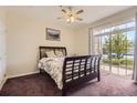 Bedroom with sliding glass door provides access to outdoors and abundant natural light at 7440 S Blackhawk St # 4-102, Englewood, CO 80112