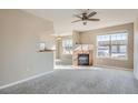 Spacious living room with a fireplace, large windows for natural light, and an open layout for easy entertaining at 7440 S Blackhawk St # 4-102, Englewood, CO 80112