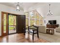 Bright foyer featuring hardwood floors, high ceilings, and a bench at 5846 S Pike Dr, Larkspur, CO 80118