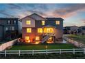 Beautiful backyard features a cozy fire pit, patio area, and well-maintained lawn perfect for outdoor gatherings at 17851 Herrera Dr, Parker, CO 80134