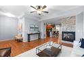Cozy living space showcasing hardwood floors and an open-concept layout at 10204 Ridgegate Cir, Lone Tree, CO 80124