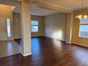 Spacious living room featuring hardwood floors and a large window at 560 Hampstead Ave, Castle Rock, CO 80104