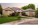 Beautiful brick home with well-maintained landscaping, a bay window, and an inviting entrance at 3231 Oak St, Wheat Ridge, CO 80033