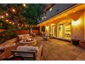 Patio with a fire pit, string lights, seating, and a dining area; perfect for outdoor entertaining at 2558 Premier Pl, Boulder, CO 80304