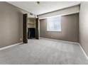 Bedroom with grey carpeting, closet, and window with blinds at 7335 E Quincy Ave # 303, Denver, CO 80237