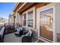 Inviting front porch with seating, perfect for relaxing and enjoying the neighborhood ambiance at 3751 W 136Th Ave # S3, Broomfield, CO 80023