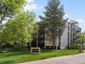 Exterior of the Morningside Condominiums building showcasing well-maintained landscaping at 3470 S Poplar St. # 110, Denver, CO 80224