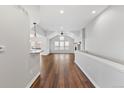 Bright living room with vaulted ceilings, wood floors, and a fireplace at 7560 S Biloxi Ct, Aurora, CO 80016