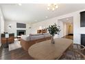 Cozy living room featuring fireplace and wood floors at 1388 Castle Creek Cir, Castle Rock, CO 80104