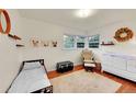 Bright bedroom with hardwood floors features a twin bed and Bedroom furniture at 1241 Wabash St, Denver, CO 80220