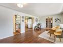 Inviting living room showcasing hardwood floors and seamless open floor plan at 1666 S Bryant St, Denver, CO 80219