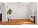 Bright living room features hardwood floors and a white painted wall at 1580 Quince St, Denver, CO 80220