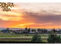 Scenic sunset view from this community, showcasing an orange sky over the mountains at 18714 E Utah Cir, Aurora, CO 80017