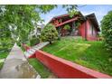 A charming house with a brick facade, manicured lawn, and inviting front porch at 2131 Eliot St, Denver, CO 80211