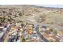 Wider aerial view showing surrounding area and landscape at 1927 S Xenon St, Lakewood, CO 80228