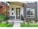 Inviting entryway with seating, modern address numbers, and stylish landscaping for a welcoming curb appeal at 3885 Vrain St, Denver, CO 80212