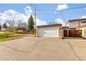 Detached two car garage next to a park with playground on a sunny day at 12893 W Alameda Dr, Lakewood, CO 80228
