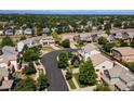 An aerial view of a residential neighborhood with tree-lined streets and well-maintained properties at 18554 E Vassar Dr, Aurora, CO 80013