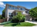Charming two-story home with lush landscaping, a two-car garage and a well maintained lawn at 3466 Craftsbury Dr, Highlands Ranch, CO 80126