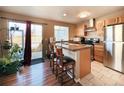 Eat-in kitchen with stainless steel appliances, granite countertops, and access to the outdoor patio at 1120 S Waco St # A, Aurora, CO 80017
