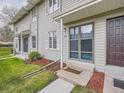 Up close of the front entry of the townhomes showing well-maintained landscaping at 1932 S Oswego Way, Aurora, CO 80014