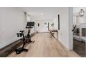 Finished basement area featuring an exercise bike, desk, and sleeping area at 7869 S Turkey Creek Rd, Morrison, CO 80465