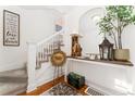 Charming foyer features hardwood floors, elegant decor, and staircase access to the upper level at 3016 N Franklin St, Denver, CO 80205
