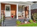 Inviting front porch features classic columns and comfortable seating at 3016 N Franklin St, Denver, CO 80205