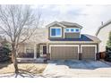 Charming two-story home with a three-car garage, landscaped front yard, and covered porch at 1280 Galactic Pl, Castle Rock, CO 80108