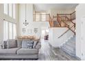 Open concept living space with staircase, dining area, and views into other rooms at 1280 Galactic Pl, Castle Rock, CO 80108