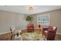 Comfortable living room with natural light and elegant furnishings on hardwood floors at 6528 S Louthan St, Littleton, CO 80120