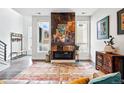 Bright living room with decorative fireplace and large windows, offering a modern design at 3444 Navajo St # 10, Denver, CO 80211