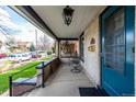 Inviting covered porch with seating area, perfect for relaxing outdoors at 3445 N Clay St, Denver, CO 80211