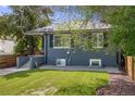 Charming home with a well-maintained lawn and inviting front porch at 1765 Xenia St, Denver, CO 80220