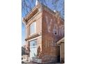 Brick exterior with visible signage, window details and neighborhood view at 701 W 6Th Ave, Denver, CO 80204