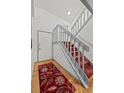 Inviting entryway with hardwood floors, a staircase with red carpet, and a white front door at 8060 Meadowdale Sq, Niwot, CO 80503