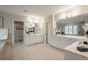 Elegant primary bathroom features dual vanities, granite counters, and modern lighting at 101 Glenmoor Ln, Cherry Hills Village, CO 80113