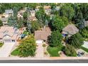 An aerial shot of a home surrounded by lush greenery in a neighborhood setting at 20855 E Lyttle Dr, Parker, CO 80138
