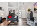 Bright living room featuring hardwood floors and comfortable seating at 3218 S Andes St, Aurora, CO 80013