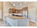 Well-equipped kitchen featuring granite countertops, modern appliances, and ample counter space at 31101 Black Eagle Dr # 202, Evergreen, CO 80439