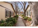 Exterior view showcasing the well-maintained walkway between two units at 3512 S Kittredge St # A, Aurora, CO 80013