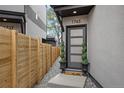 Charming entrance with decorative plants and a modern front door at 1745 Lowell Blvd, Denver, CO 80204