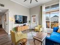 Cozy living room featuring modern decor, a large screen TV, and comfortable seating at 2678 Syracuse St # 204, Denver, CO 80238