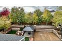 Expansive backyard with patio, gazebo, mature trees, and space for outdoor activities at 9011 Sandpiper Dr, Longmont, CO 80504