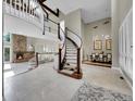 Grand curved staircase and high ceilings at 6325 E Tufts Ave, Cherry Hills Village, CO 80111