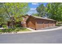 Exterior view of the house with detached, oversized three-car garage at 8010 Holland Ct # D, Arvada, CO 80005